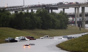 Cars are stranded on 288 at the 610 loop, which became flooded after an afternoon downpour in Southwest Houston, Saturday, April 27, 2013. (AP Photo/Houston Chronicle, Cody Duty)