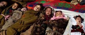 The bodies of Afghan children are laid outside home destroyed in US drone attack. Source, Associated Press.