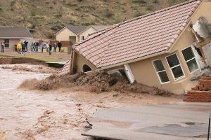 Homes fall to flash flooding in California. Source NBC News.
